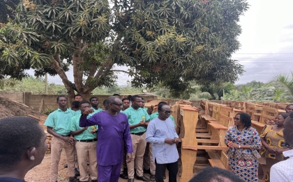 Distribution of school desks by the Hon DCE to the various schools